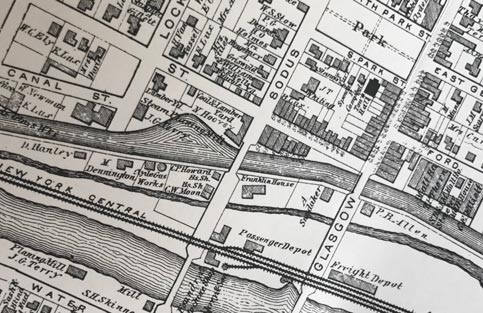 From Perkins Block (red circle), Glasgow Street with South Park to Passenger Depot (blue circle), walking distance is 15'