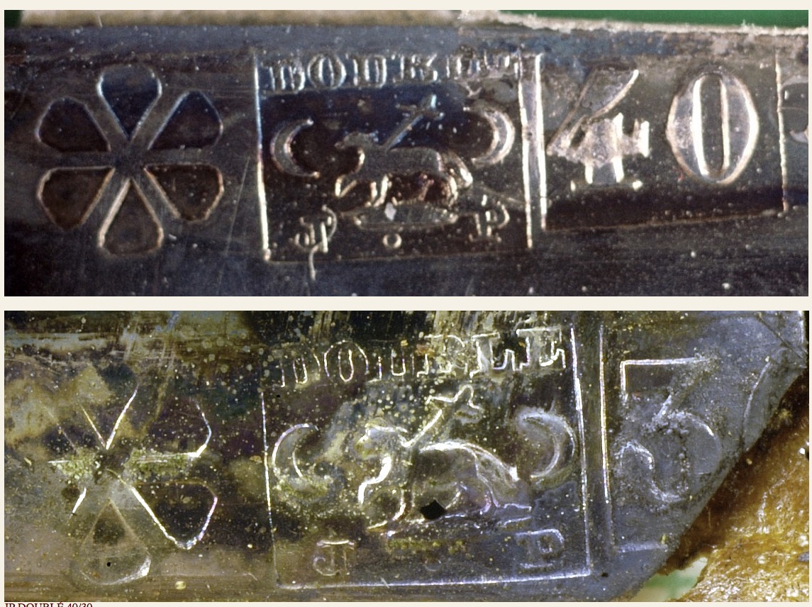 Hallmark in the lower left corner, indicating the plate manufacturer or supplier